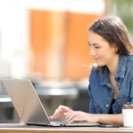 Attractive young woman using a laptop