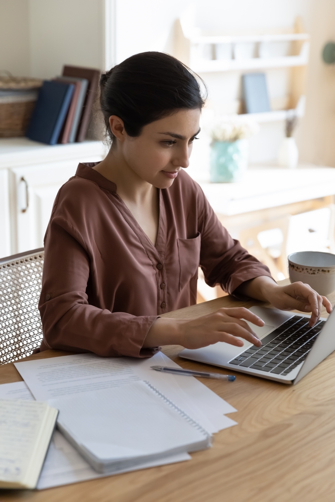 Woman looking at laptop